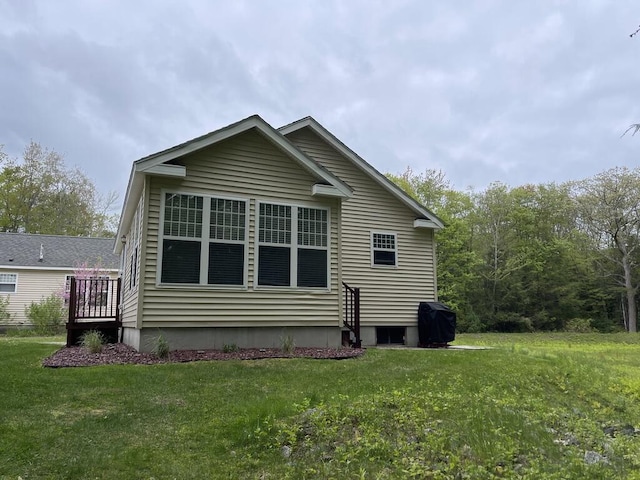 412 Post Rd Unit 253, Wells, ME 04090 - view of side of home with a yard and a wooden deck