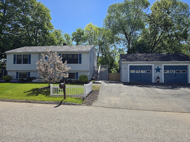 5 Roland Ave, Lewiston, ME 04240 - view of front of property with a garage
