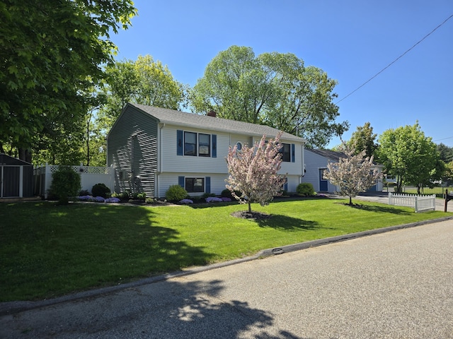 5 Roland Ave, Lewiston, ME 04240 - view of front of house with a chimney