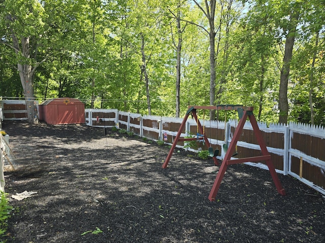 5 Roland Ave, Lewiston, ME 04240 - view of jungle gym with a fenced backyard
