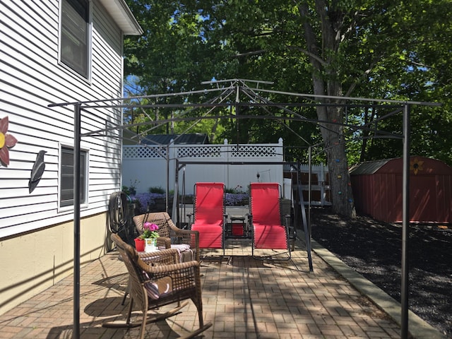 5 Roland Ave, Lewiston, ME 04240 - wooden deck with a patio area and a fenced backyard
