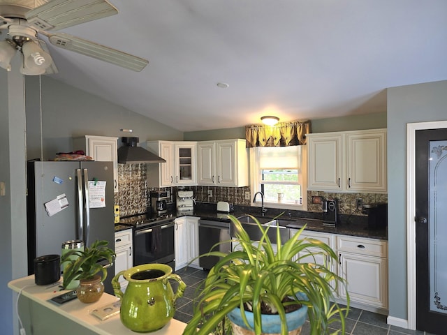 5 Roland Ave, Lewiston, ME 04240 - kitchen with appliances with stainless steel finishes, wall chimney range hood, backsplash, dark countertops, and vaulted ceiling