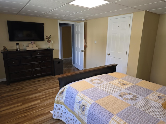 5 Roland Ave, Lewiston, ME 04240 - bedroom featuring a paneled ceiling, dark wood finished floors, and baseboards
