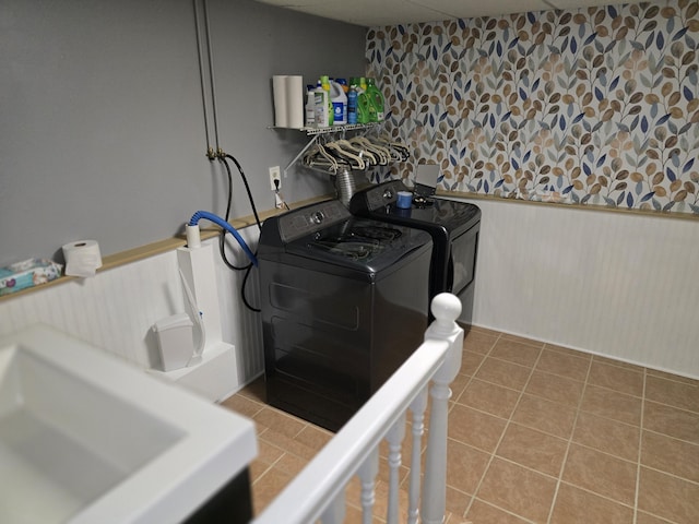 5 Roland Ave, Lewiston, ME 04240 - laundry area featuring washer and clothes dryer, a wainscoted wall, and tile patterned flooring
