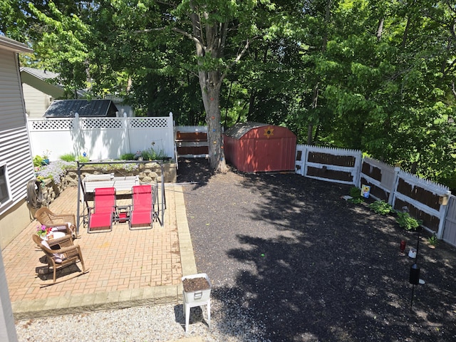 5 Roland Ave, Lewiston, ME 04240 - fenced backyard featuring outdoor dining area, a patio area, and view of scattered trees