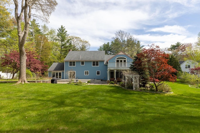 31 Rebecca Rd, Ogunquit, ME 03907 - back of property with a yard, a balcony, a patio area, and french doors