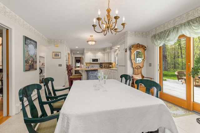 31 Rebecca Rd, Ogunquit, ME 03907 - dining area with a chandelier and baseboards