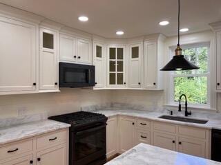 12 Windsor Rd, Ellsworth, ME 04605 - kitchen featuring black appliances, a sink, glass insert cabinets, decorative light fixtures, and recessed lighting