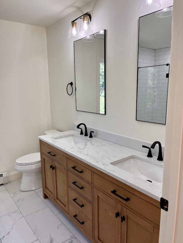 12 Windsor Rd, Ellsworth, ME 04605 - full bathroom featuring toilet, double vanity, and marble look tiles