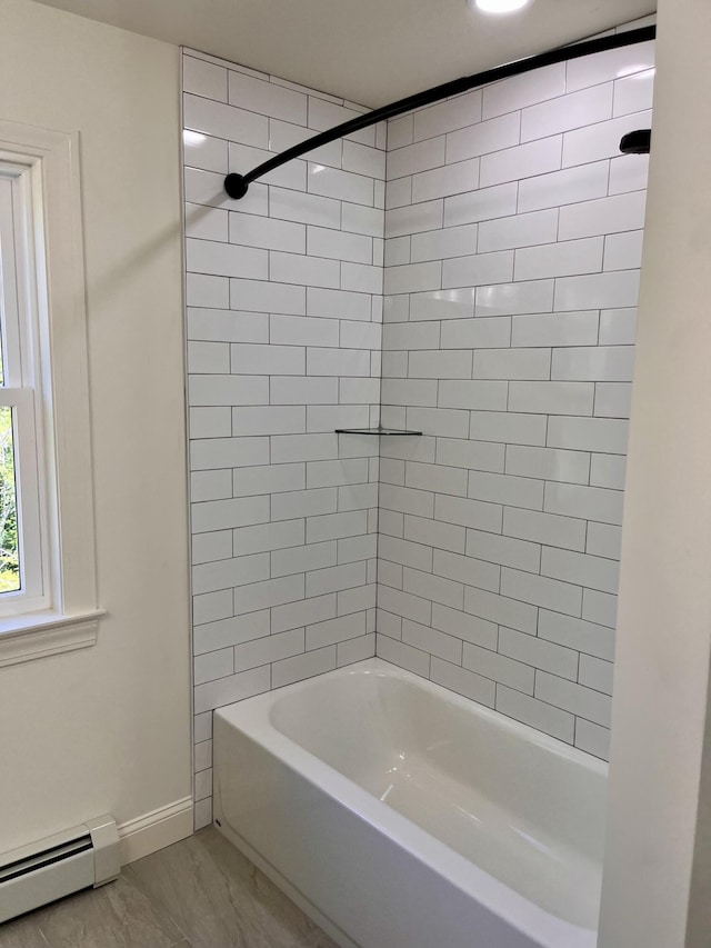 12 Windsor Rd, Ellsworth, ME 04605 - full bath with a baseboard radiator, marble look tiles, washtub / shower combination, and baseboards