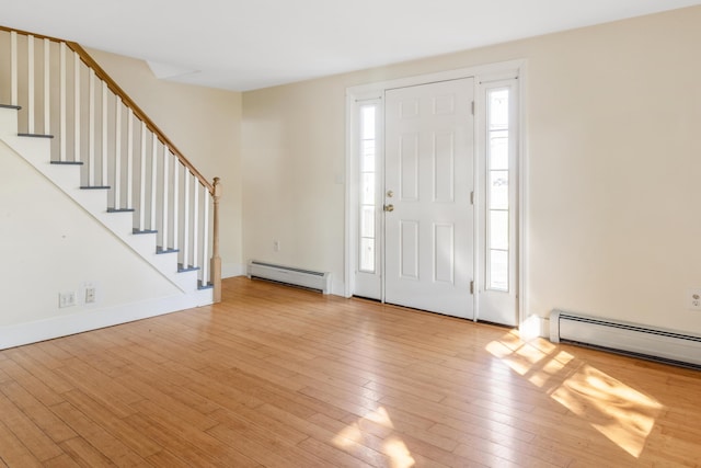 185 Depot Rd, Eliot, ME 03903 - entrance foyer featuring baseboard heating, light wood-style floors, and stairs