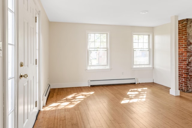 185 Depot Rd, Eliot, ME 03903 - empty room with a baseboard radiator, light wood-style floors, and baseboards