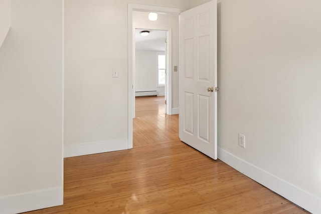 185 Depot Rd, Eliot, ME 03903 - corridor with a baseboard radiator, baseboards, and light wood finished floors