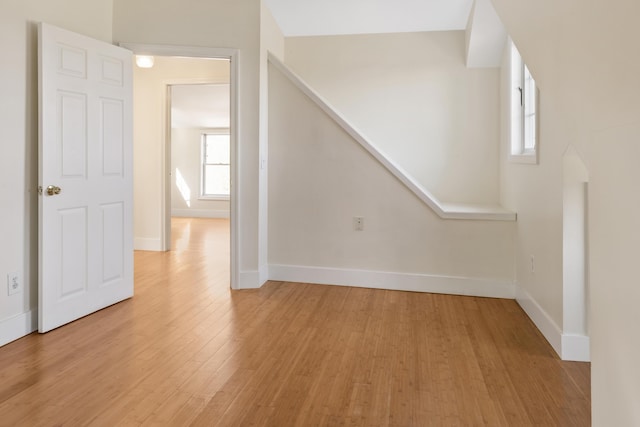 185 Depot Rd, Eliot, ME 03903 - unfurnished living room featuring light wood-style floors, plenty of natural light, and baseboards