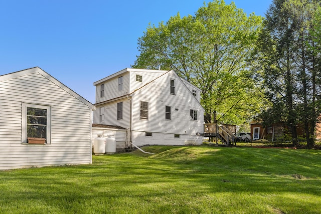 185 Depot Rd, Eliot, ME 03903 - back of house featuring a lawn and a wooden deck