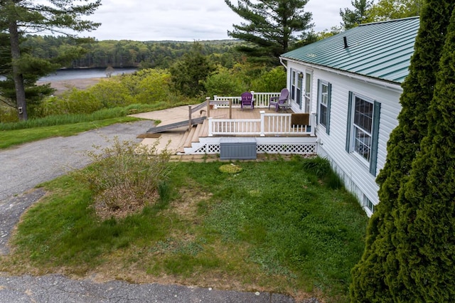 31 Lakeview Dr, West Bath, ME 04530 - view of yard with a deck and a wooded view