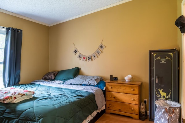 31 Lakeview Dr, West Bath, ME 04530 - bedroom with wood finished floors, ornamental molding, and a textured ceiling