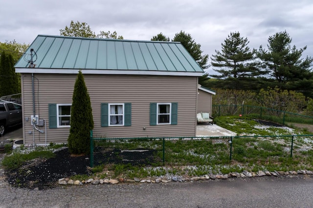 31 Lakeview Dr, West Bath, ME 04530 - view of home's exterior with a standing seam roof and metal roof