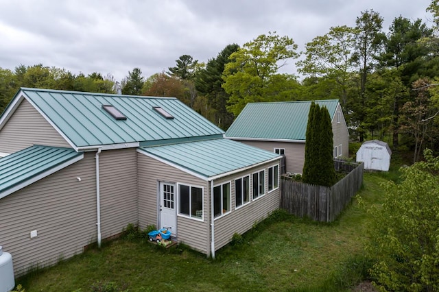 31 Lakeview Dr, West Bath, ME 04530 - back of house with a standing seam roof and metal roof