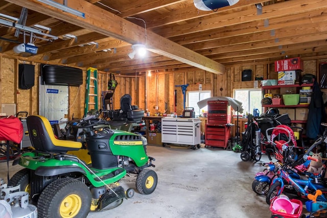 31 Lakeview Dr, West Bath, ME 04530 - garage featuring a garage door opener