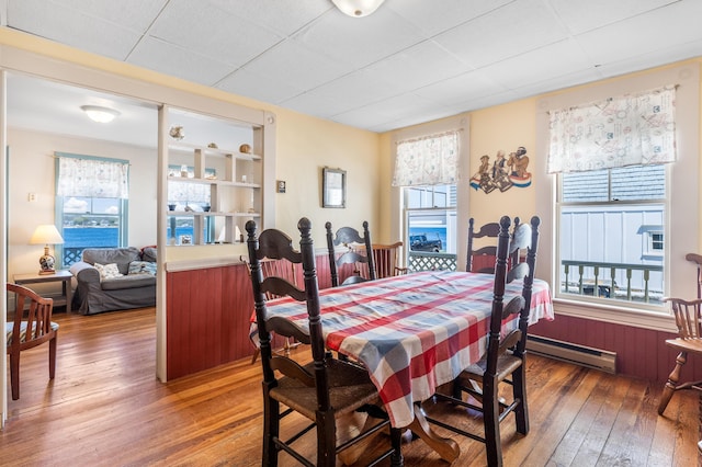 27 Ocean Ave Extension Unit 2, York, ME 03909 - dining space featuring a baseboard heating unit, hardwood / wood-style flooring, plenty of natural light, and a paneled ceiling
