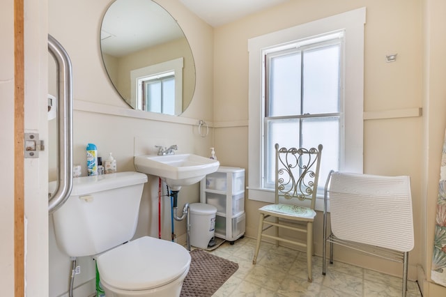 27 Ocean Ave Extension Unit 2, York, ME 03909 - bathroom featuring marble look tile flooring, toilet, and a sink