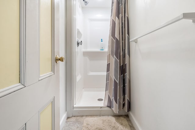 27 Ocean Ave Extension Unit 2, York, ME 03909 - full bathroom with a stall shower, baseboards, and tile patterned flooring
