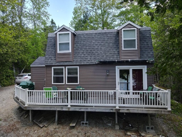 101 Brooks & Dunn Road, Otis, ME 04605 - back of property with a shingled roof and a wooden deck