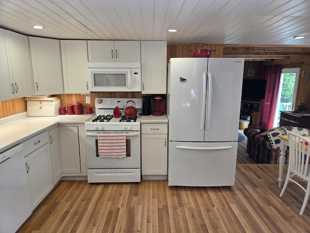 101 Brooks & Dunn Road, Otis, ME 04605 - kitchen featuring white appliances, white cabinetry, light countertops, recessed lighting, and wooden ceiling