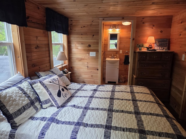 101 Brooks & Dunn Road, Otis, ME 04605 - bedroom featuring wood ceiling, wood walls, and ensuite bathroom