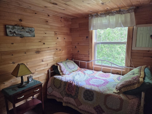 101 Brooks & Dunn Road, Otis, ME 04605 - bedroom featuring wood walls and wood ceiling