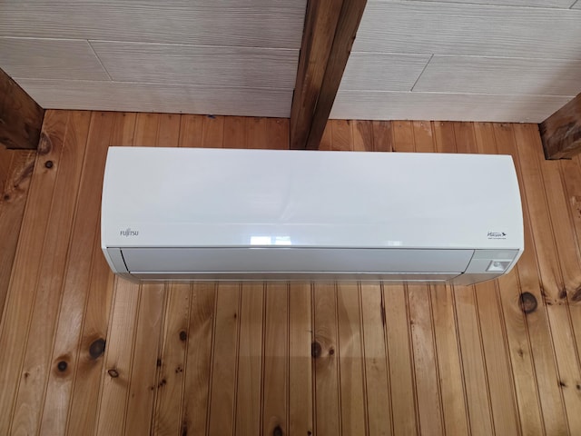 101 Brooks & Dunn Road, Otis, ME 04605 - detailed view of an AC wall unit and wooden walls