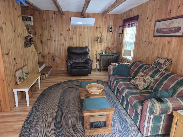 101 Brooks & Dunn Road, Otis, ME 04605 - living room featuring wood finished floors, beam ceiling, and wood walls