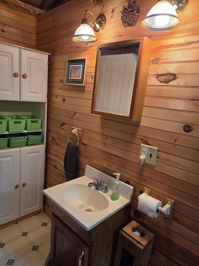 101 Brooks & Dunn Road, Otis, ME 04605 - bathroom with wood walls and vanity