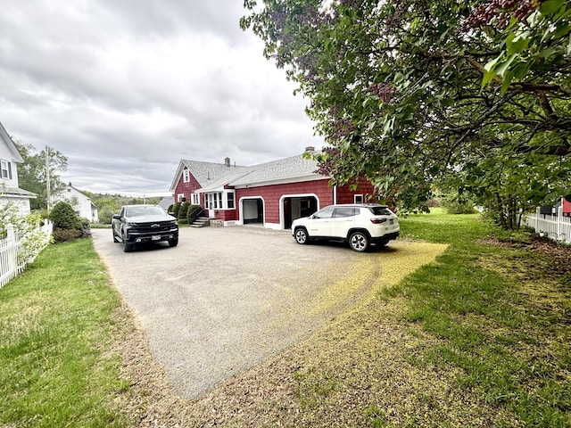 187 Maine Ave, Millinocket, ME 04462 - view of front facade featuring driveway and a shingled roof