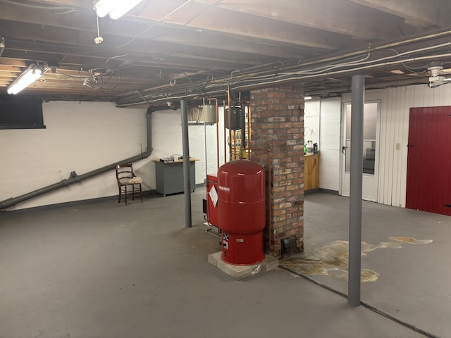 187 Maine Ave, Millinocket, ME 04462 - unfinished basement featuring a water pressure tank