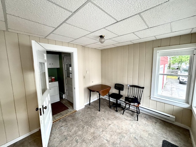 187 Maine Ave, Millinocket, ME 04462 - living area with a drop ceiling, washer / clothes dryer, and a baseboard heating unit