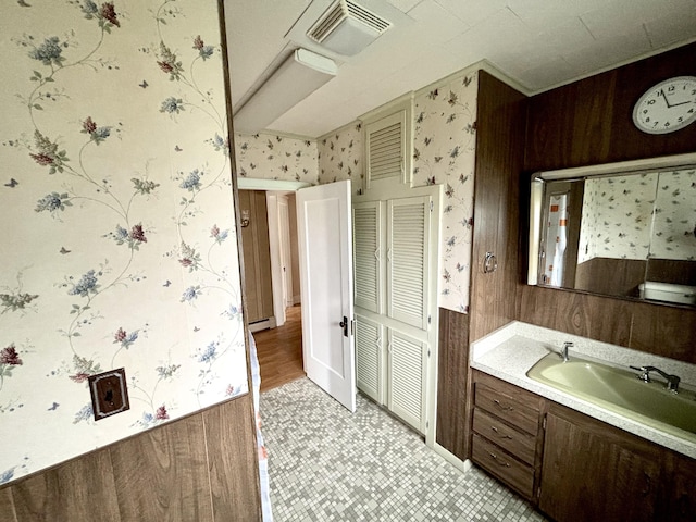 187 Maine Ave, Millinocket, ME 04462 - bathroom with wallpapered walls, vanity, and tile patterned floors