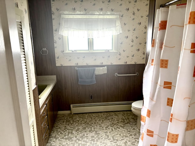 187 Maine Ave, Millinocket, ME 04462 - bathroom featuring wallpapered walls, vanity, a baseboard radiator, toilet, and a wainscoted wall