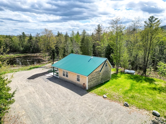 30 Bassett Ln, Moscow, ME 04920 - view of subject property with a heavily wooded area