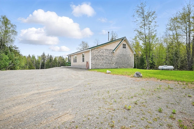 30 Bassett Ln, Moscow, ME 04920 - view of home's exterior with gravel driveway