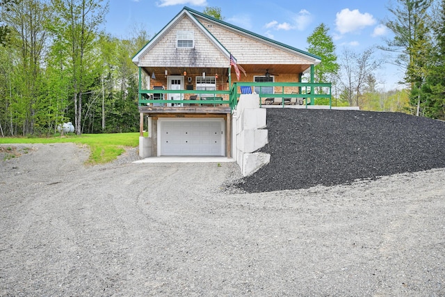 30 Bassett Ln, Moscow, ME 04920 - view of front of property with gravel driveway and a garage