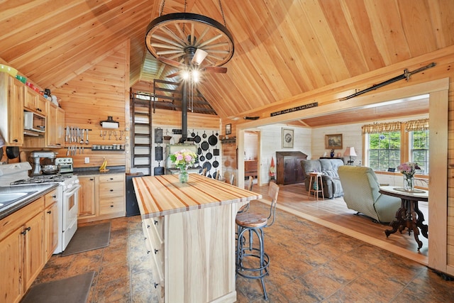 30 Bassett Ln, Moscow, ME 04920 - kitchen featuring white gas range oven, wood counters, lofted ceiling, wooden ceiling, and wooden walls