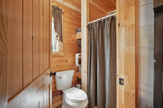 30 Bassett Ln, Moscow, ME 04920 - full bath with wooden walls, toilet, and a shower with curtain