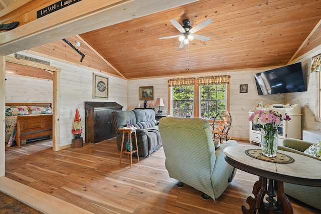 30 Bassett Ln, Moscow, ME 04920 - living room with vaulted ceiling, wood walls, hardwood / wood-style flooring, wooden ceiling, and ceiling fan