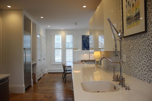 67 Pascal Ave, Rockport, ME 04856 - kitchen featuring dark wood-style flooring, recessed lighting, a baseboard heating unit, a sink, and light countertops