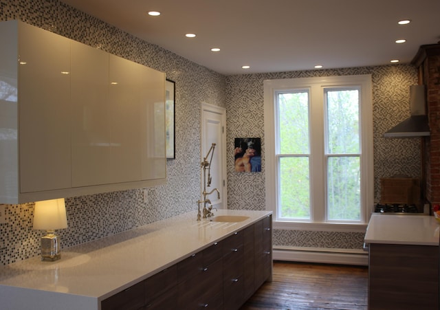 67 Pascal Ave, Rockport, ME 04856 - bathroom featuring a baseboard radiator, wood finished floors, healthy amount of natural light, decorative backsplash, and recessed lighting
