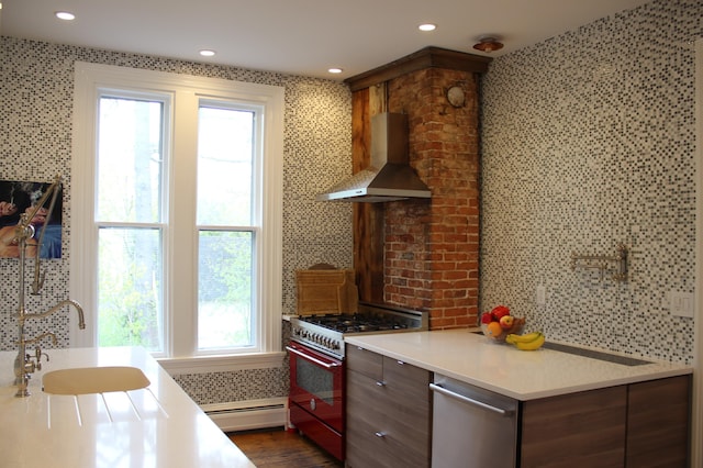 67 Pascal Ave, Rockport, ME 04856 - kitchen featuring stainless steel appliances, wall chimney exhaust hood, baseboard heating, light countertops, and recessed lighting