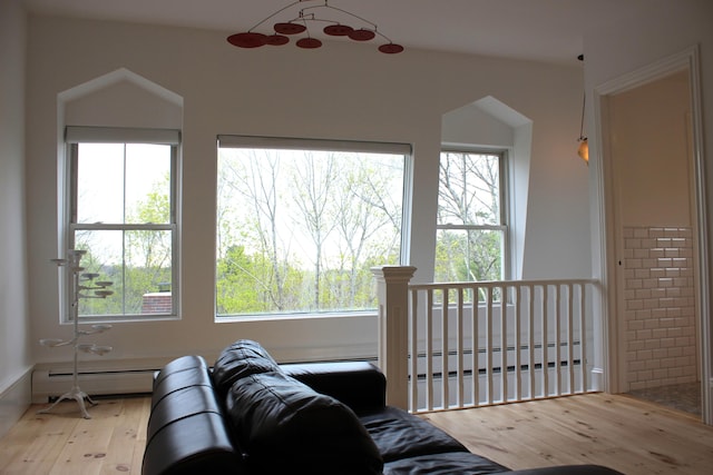 67 Pascal Ave, Rockport, ME 04856 - living room featuring baseboard heating, a baseboard heating unit, wood finished floors, and healthy amount of natural light