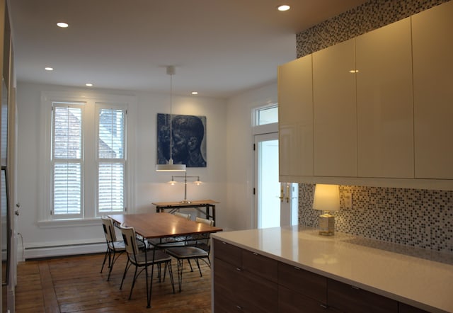 67 Pascal Ave, Rockport, ME 04856 - dining space with dark wood finished floors, healthy amount of natural light, recessed lighting, and a baseboard radiator